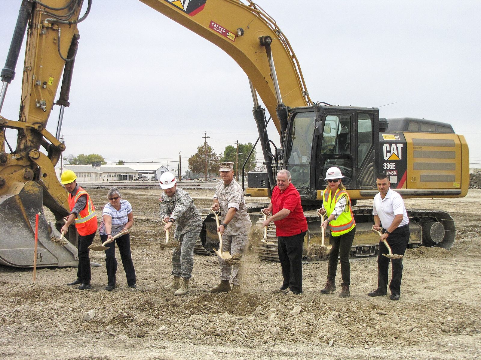 Army Corps of Engineers and contractor staff breaking ground on a federal distribution facility